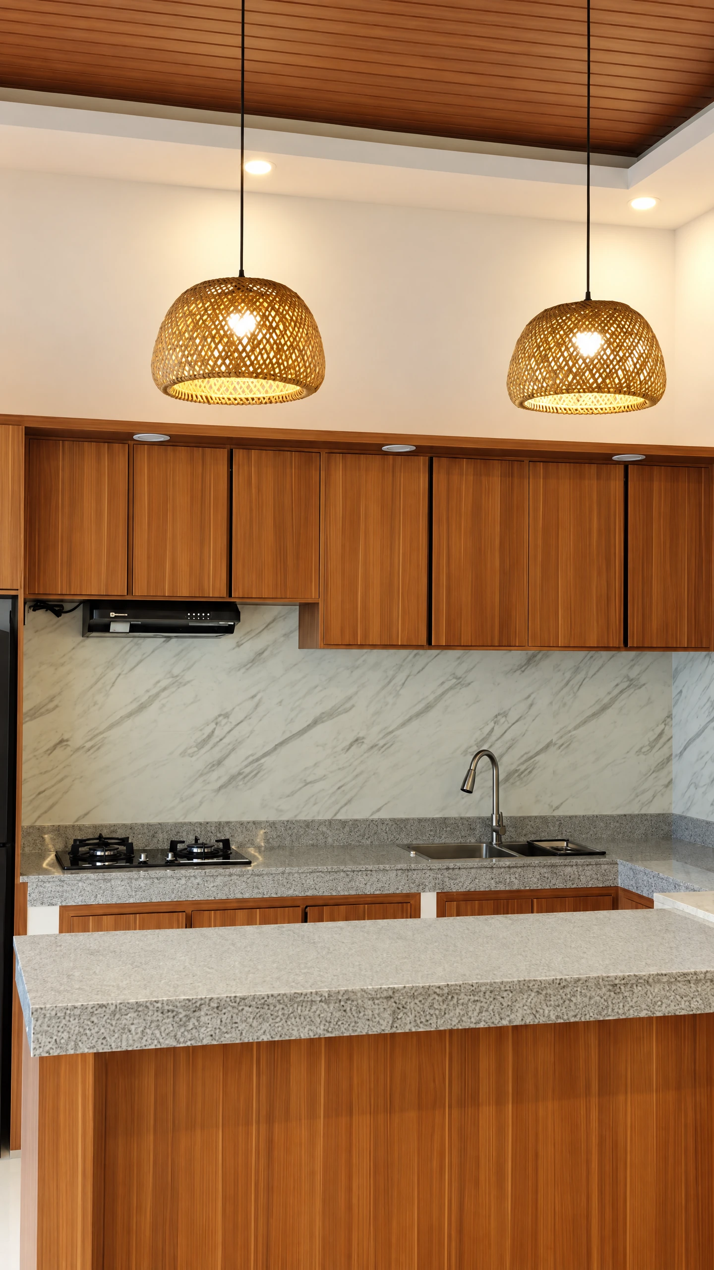 Warm timber kitchen with marble surfaces and woven pendant lights