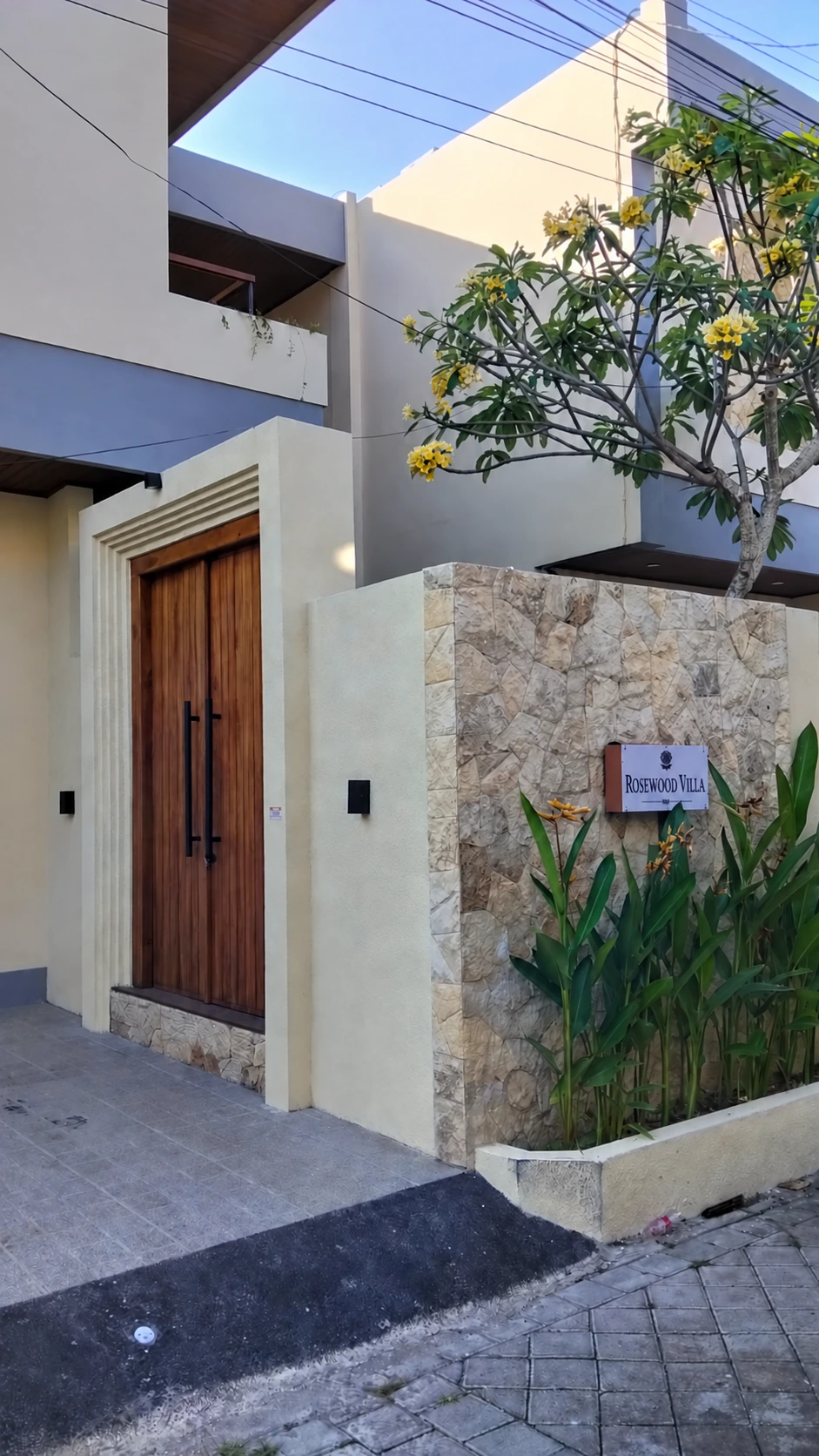 Rosewood Villa's tropical stone facade and entrance in Canggu, Bali